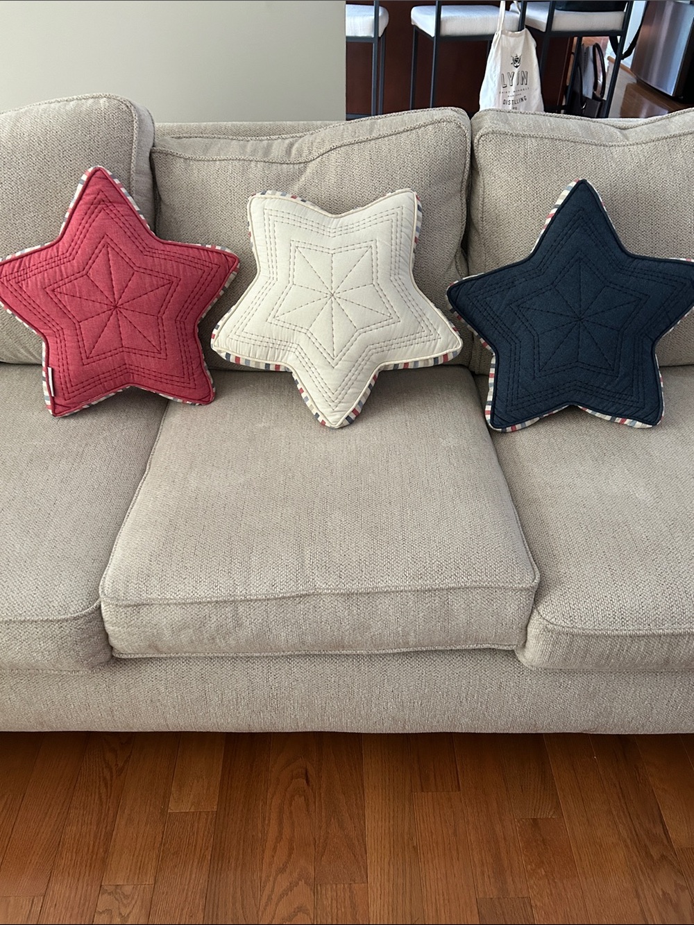 cupcakes & cashmere Star-Shaped Holiday Pillow Trio in Red, Cream & Navy